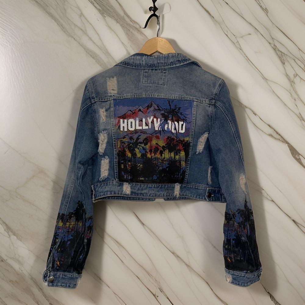 Super cute denim jacket with Graffiti style painted design.